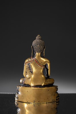 Lot 9 - A LARGE SILVER AND COPPER  INLAID BRONZE FIGURE OF SHAKYAMUNI BUDDHA, TIBET, 15TH CENTURY