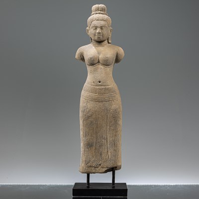 Lot 133 - STANDING SOUTH-EAST ASIAN SANDSTONE FIGURE OF UMA IN BAPHUOAN STYLE