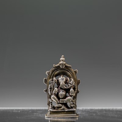 Lot 7 - INDIAN 16TH CENTURY SEATED SILVER GANESHA INSCRIBED AT THE BACK