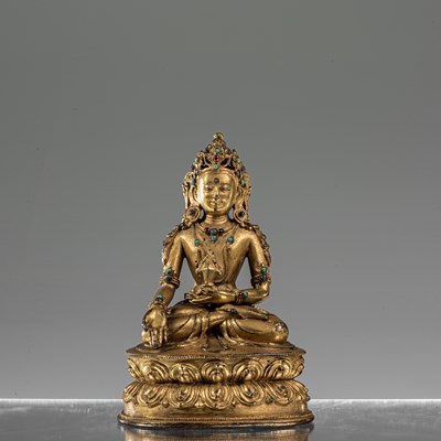 Lot 31 - MEDICINE BRONZE FIREGILT BUDDHA TIBET 16TH CENTURY