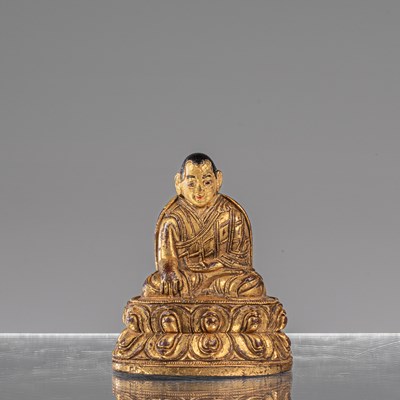 Lot 16 - SEATED BRONZE FIRGILT LAMA TIBET 18TH CENTURY