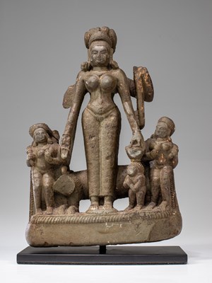 Lot 58 - LIME STONE SURYA WITH CONSORTS NEPAL 15TH CENTURY