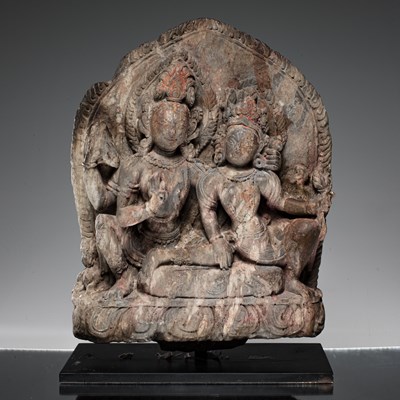 Lot 55 - SHIVA AND PARVATI AS UMA MAHESVARA STONE NEPAL 18TH CENTURY