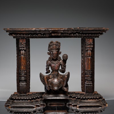 Lot 13 - KARTIKEYA OR KUMARA WITH PEACOCK WOOD 16TH CENTURY NEPAL NEWAR CULTURE IN TORANA