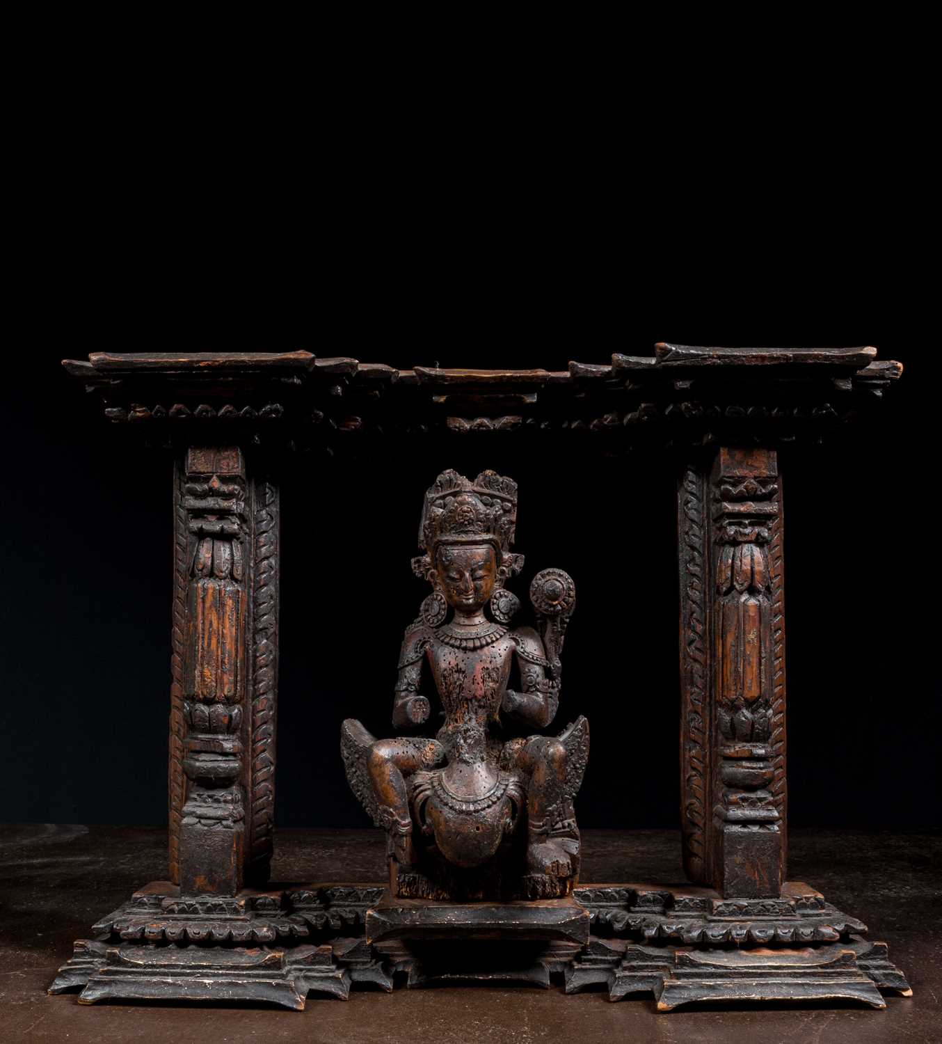 Lot 13 - KARTIKEYA OR KUMARA WITH PEACOCK WOOD 16TH CENTURY NEPAL NEWAR CULTURE IN TORANA