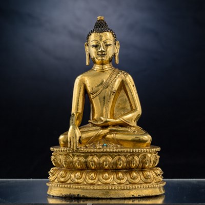 Lot 15 - SEATED BRONZE GILT AKSHOBYA BUDDHA TIBET 14TH CENTURY