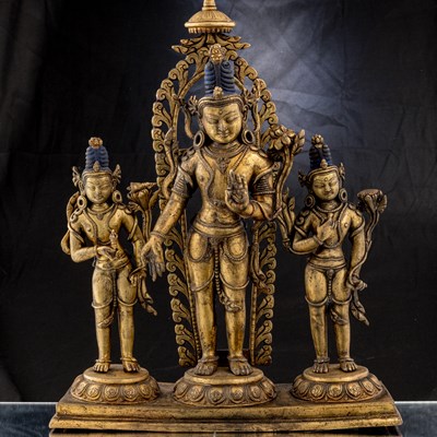 Lot 29 - GILD BRONZE TRIAD OF AVALOKITESHVARA TIBET 19TH CENTURY