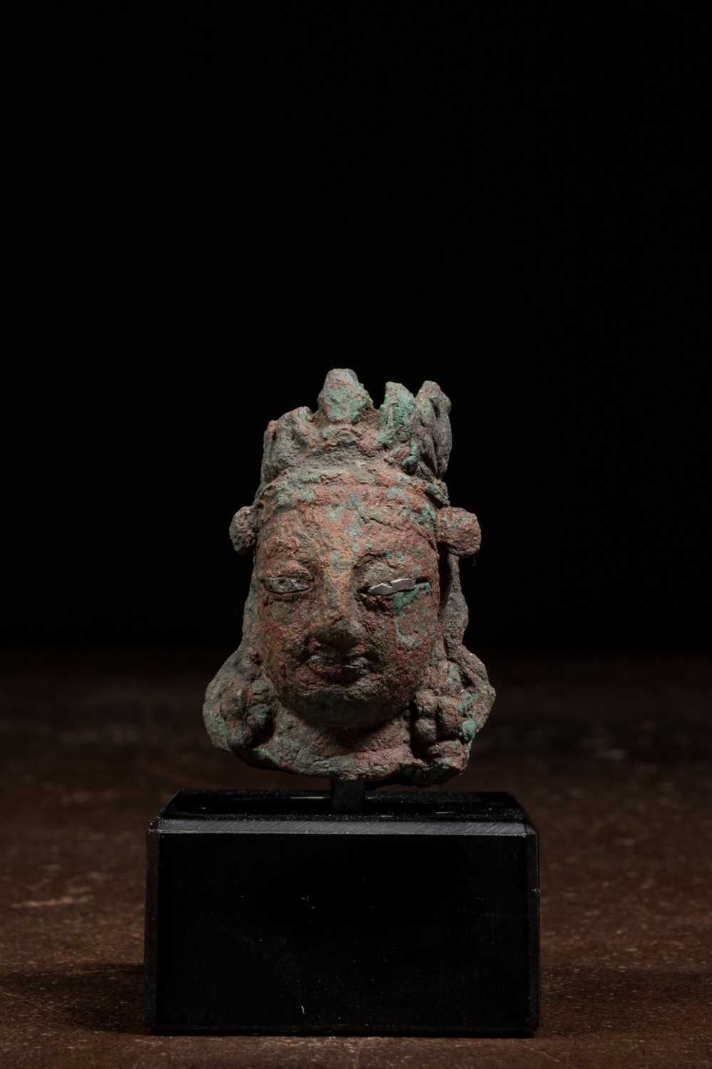 Lot 196 - BODHISATTVA HEAD SWAT VALLEY BRONZE WITH SILVER 7TH - 9TH CENTURY