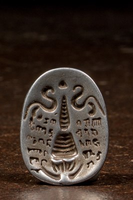 Lot 43 - TSA TSA FORM DEPICTING A STUPA SILVER TIBET 17TH CENTURY