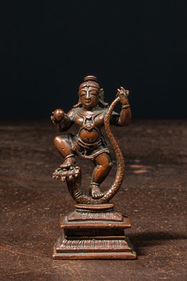 Lot 187 - A BRONZE FIGURE OF KRISHNA SUBDUING KĀLIYA 17TH CENTURY
