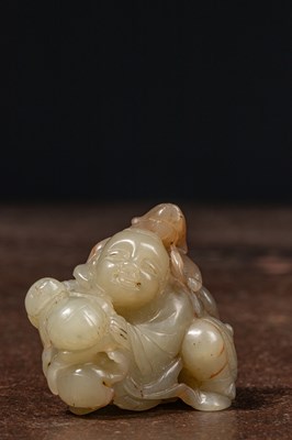 Lot 110 - A CELADON JADE CARVING OF A BOY AND MONKEY CHINA QING DYNASTY