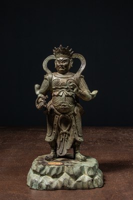 Lot 25 - A BRONZE FIGURE OF VIRŪPAKA, GUARDIAN KING OF THE WEST CHINA MING DYNASTY