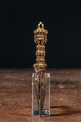 Lot 113 - A GILT BRONZE PHURBU TIBET 17TH CENTURY