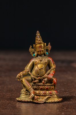 Lot 17 - A SEATED BRONZE GILT JAMBHALA TIBET 13TH CENTURY STYLE BUT LATER