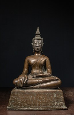 Lot 162 - A BRONZE SEATED BUDDHA WITH INSCRIPTION AND SILVERED FACE LAOS 18TH tO 19TH CENTURY