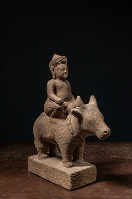 Lot 166 - A SANDSTONE FIGURE OF SKANDA RIDING NANDI KHMER EMPIRE ANGKOR PERIOD 12TH CENTURY