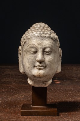 Lot 120 - A MARBLE HEAD OF A BUDDHA NORTHERN QI DYNASTY 6TH CENTURY CHINA