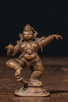 Lot 210 - A DANCING BRONZE FIGURE OF KRISHNA AS MĀKHAN CHOR INDIA 18TH CENTURY