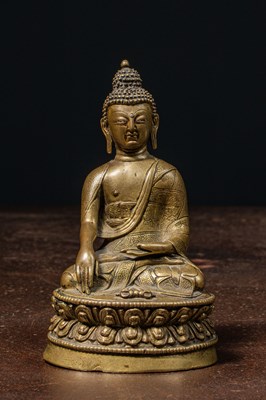 Lot 106 - SEATED BRONZE BUDDHA TIBET 15TH CENTURY WITH SILVER EYE
