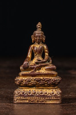 Lot 215 - SEATED BRONZE GILT BUDDHA NEPAL 16TH CENTURY