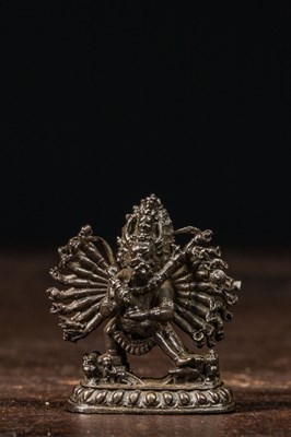 Lot 213 - MINIATURE SILVER MAHAKALA SCULPTURE OF A GAU TIBET 19TH CENTURY