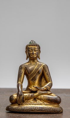 Lot 236 - A SEATED BRONZE GILT BUDDHA, TIBET, 15TH CENTURY