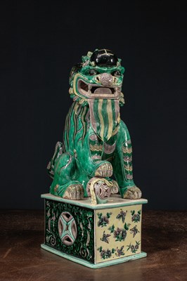 Lot 26 - (R) A RARE AND IMPRESSIVE SANCAI-GLAZED POTTERY FIGURE OF A BUDDHIST LION QING DYNASTY CHINA