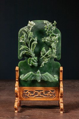 Lot 50 - (R) A GREEN JADE SCREEN WITH BAT, FLOWERS, AND BIRDS QING DYNASTY (1644-1911) China