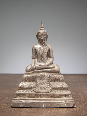 Lot 431 - (R) A SILVER ALLOY SEATED BUDDHA WITH INSCRIPTION, LAOS APPROX 1900