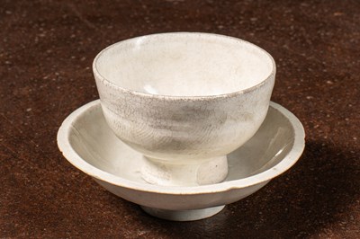 Lot 87 - (R) A WHITE-GLAZED TEA BOWL WITH MATCHING SAUCER, SONG DYNASTY (960–1279)