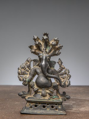 Lot 316 - A SEATED BRONZE GANESHA, INDIA, 17TH CENTURY