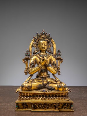 Lot 254 - A SEATED BRONZE GILT BUDDHA OF VAIROCANA, TIBET, 18TH CENTURY