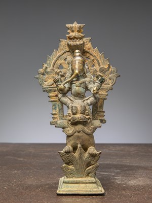 Lot 348 - A GANESHA SEATED ON A LION, BRONZE, INDIA 18TH CENTURY