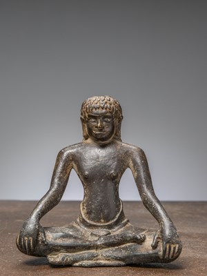 Lot 344 - A SEATED BRONZE YOGI, INDIA 12TH CENTURY, WITH SILVER EYES