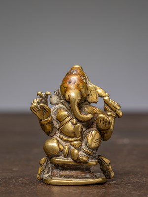Lot 323 - A SEATED BRONZE GANESHA, INDIA, 17TH CENTURY