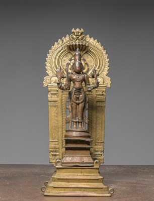 Lot 362 - A LARGE STANDING BRONZE BHAIRABA, INDIA, 16TH CENTURY WITH LATER SHRINE