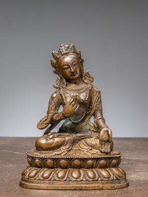 Lot 42 - A SEATED BRONZE TARA WITH REMAINS OF GILDING, CHINA QING DYNASTY