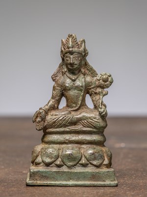 Lot 321 - A SEATED SWAT VALLEY BRONZE OF PADMAPANI, WITH SILVER EYES, KASHMIR 12TH CENTURY