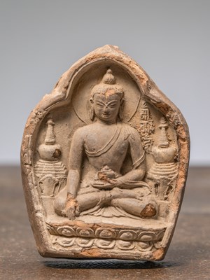 Lot 228 - A CLAY TSA TSA DEPICTING BUDDHA BETWEEN STUPAS, TIBET, 16TH CENTURY
