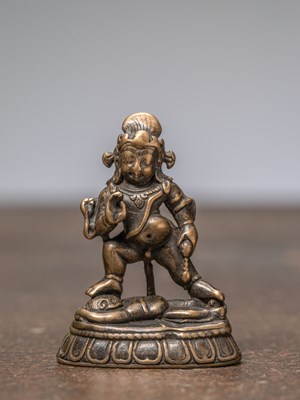 Lot 261 - A STANDING BLACK JAMBHALA, TIBET, 15TH CENTURY