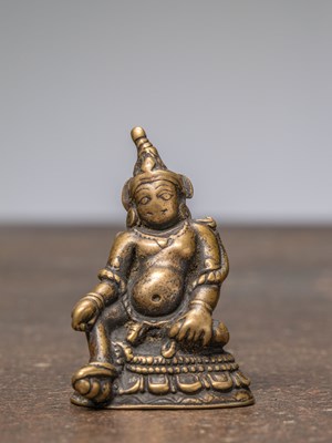 Lot 297 - A SEATED BRONZE JAMBHALA, TIBET, 13TH CENTURY