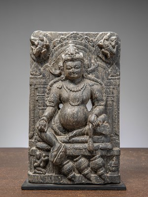 Lot 242 - A SEATED STONE CARVED JAMBHALA, INDIA 12TH CENTURY, PROBABLY PALA