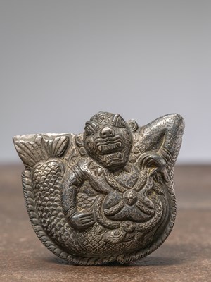 Lot 339 - A SMALL BETTLE NUT BOX, SILVER REPOUSSE, INDIA 18TH CENTURY, DEPICTING A MAKARA
