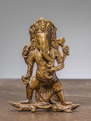 Lot 230 - A STANDING BRONZE RESTGILT GANESHA, NEPAL, 17TH CENTURY
