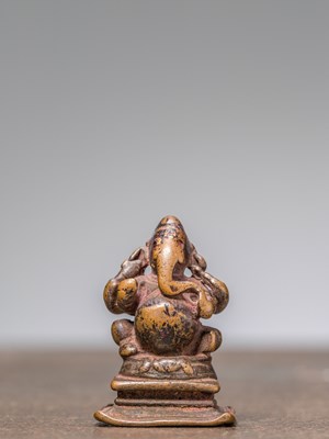 Lot 313 - A ,SMALL SEATED BRONZE GANESHA, INDIA, 15TH CENTURY