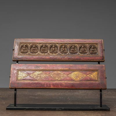 Lot 237 - A WOOD CARVED BOOKCOVER PAIR, TIBET, 16TH CENTURY