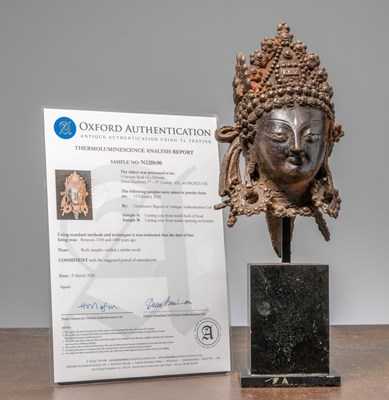 Lot 299 - A BRONZE HEAD WITH SILVER EYES, KASHMIR OR INDIA, 12TH CENTURY