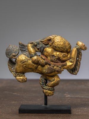Lot 243 - A COPPER REPOUSSE AND FIREGILT SNOW LION, TIBET, 18TH CENTURY