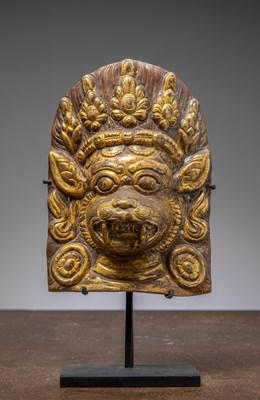Lot 276 - A COPPER REPOUSSE AND FIREGILT HEAD OF HANUMAN, NEPAL, 18TH CENTURY