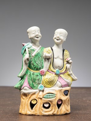 Lot 36 - (R) A PORCELAIN STATUE OF LAUGHING TWINS, LATE CHIEN LUNG PERIOD, CHINA, 1780/1790